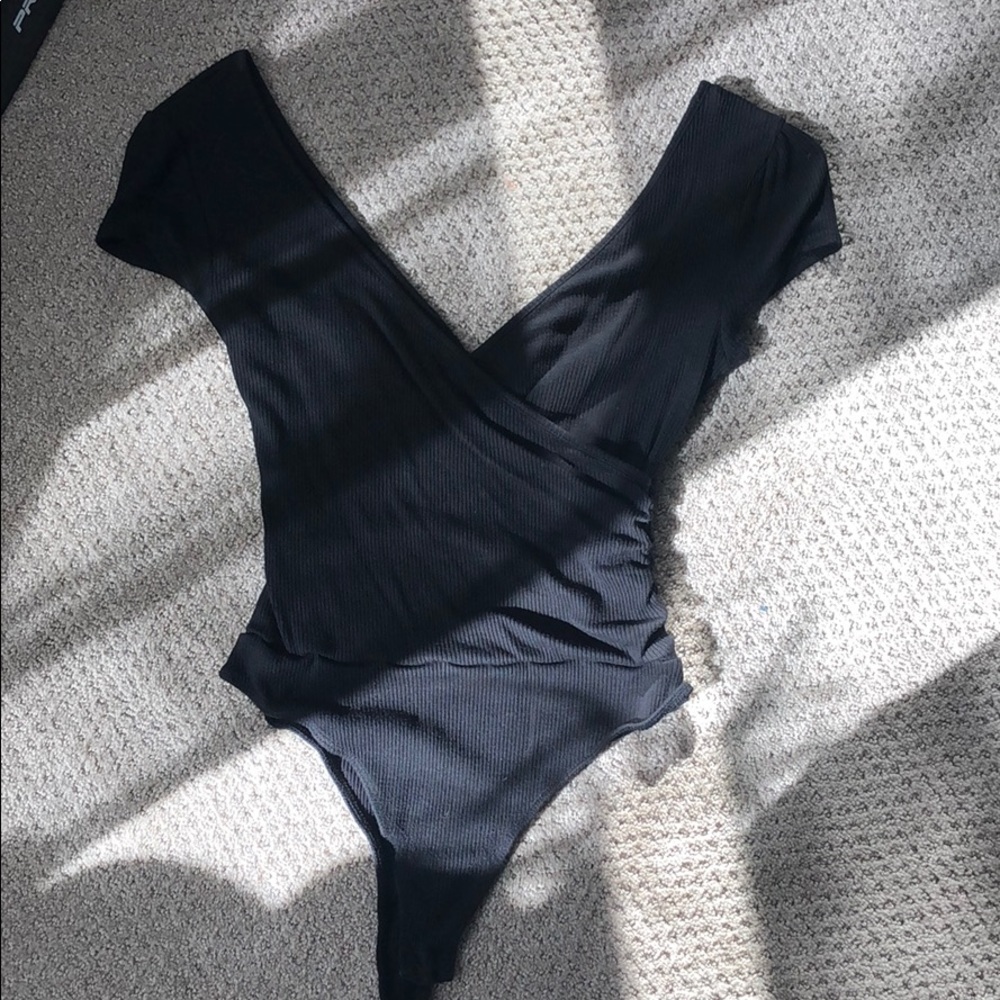 Urban Outfitters black cross onesie